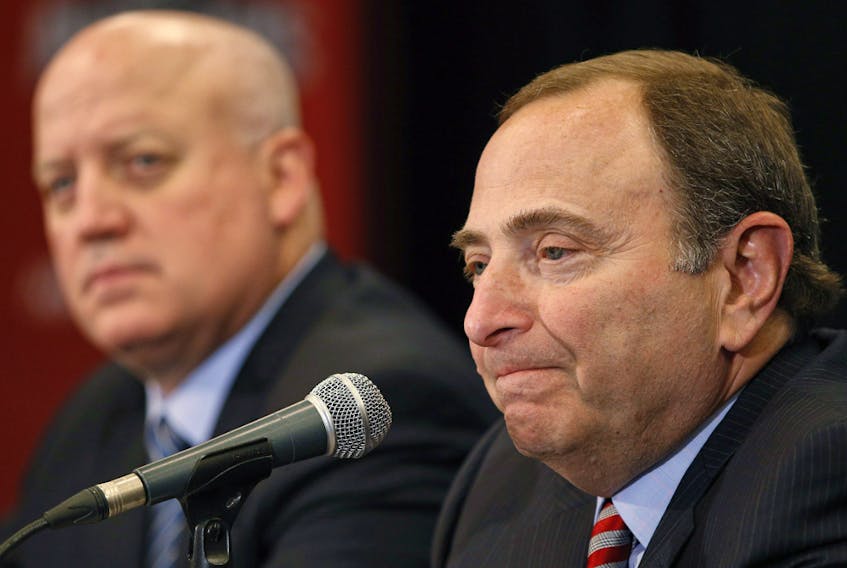 NHL commissioner Gary Bettman, right, and deputy commissioner Bill Daly appear in this file photo from the NHL Awards show on June 24, 2015, in Las Vegas.
