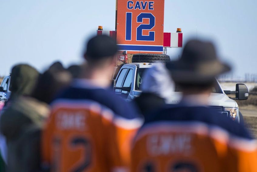 Well wishers gathered along Hwy. 16 on April 13, 2020, to show support for the family of Edmonton Oilers forward Colby Cave, who died after suffering a brain bleed. 