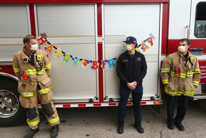 Calgary Firefighters join other emergency personnel to wish Gladys de Vries a 100th birthday at Cedars Villa Healthcare on Tuesday, April 14, 2020. 