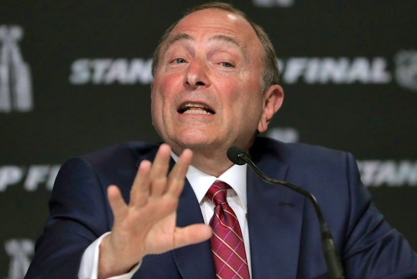 In this May 27, 2019, file photo, NHL commissioner Gary Bettman speaks to the media before Game 1 of the NHL hockey Stanley Cup Finals between the St. Louis Blues and the Boston Bruins, in Boston.