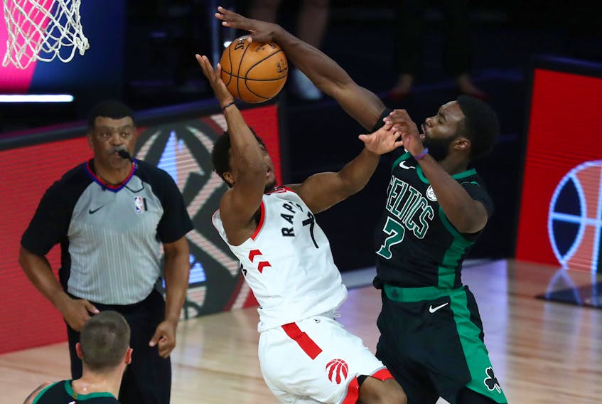 Boston Celtics guard Jaylen Brown (right) fouls Toronto Raptors guard Kyle Lowry (left) during the second half of game two.