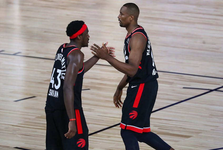 Raptors big men Serge Ibaka (right) and Pascal Siakam celebrate during their Game 4 win. 