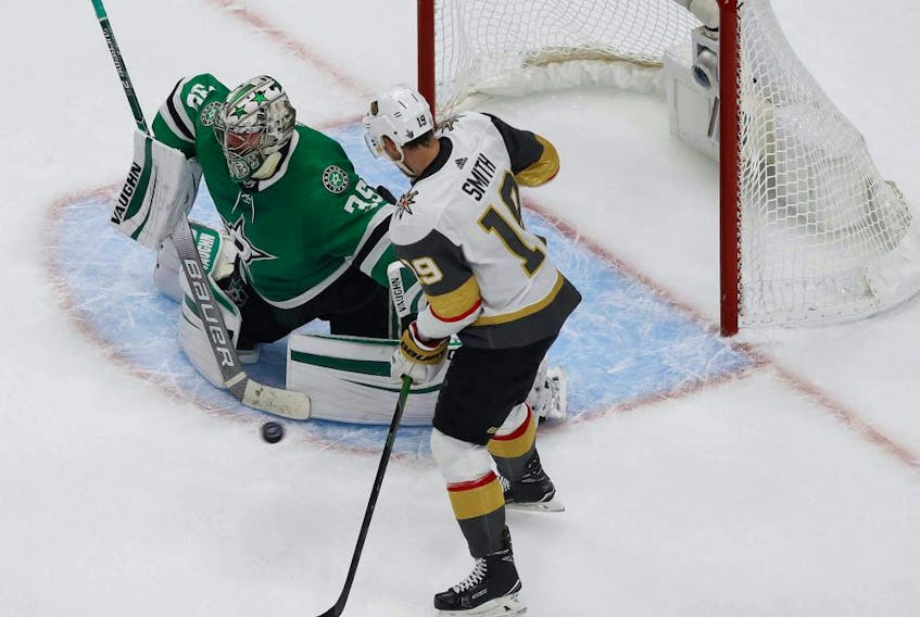 Dallas Stars goaltender Anton Khudobin (35) defends the goal against Vegas Golden Knights right wing Reilly Smith (19) during the third period in Game. 4 of the Western Conference Final of the 2020 Stanley Cup Playoffs at Rogers Place on Aug. 12, 2020. 