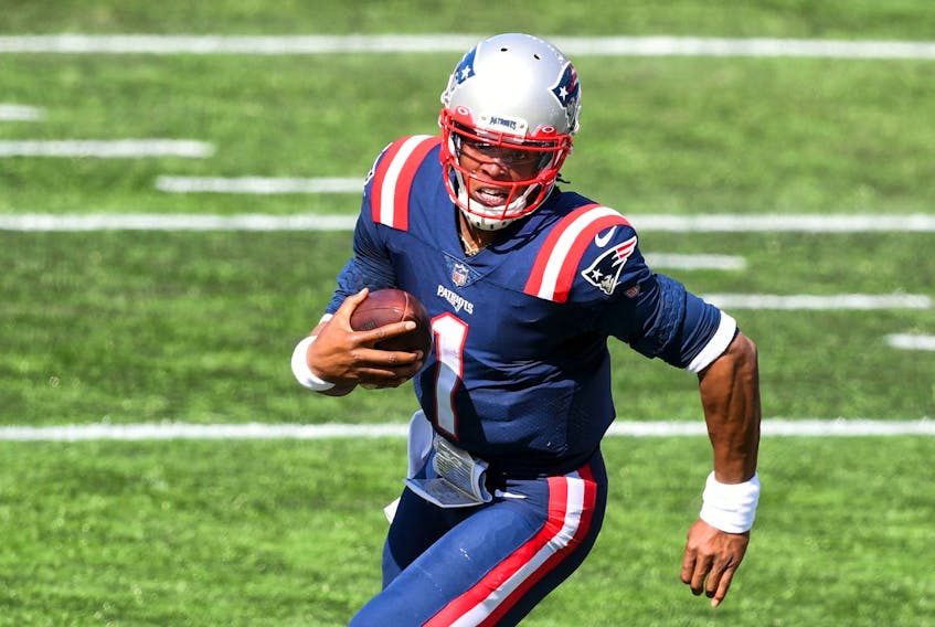 QB Cam Newton, running in for a TD against Miami in his Patriots debut, showed he’d be the team’s top QB from his early days in camp.  