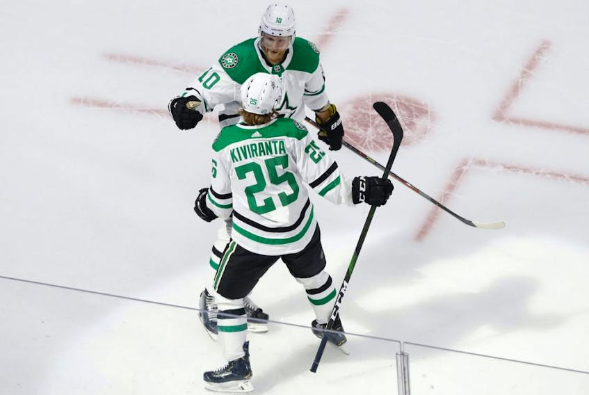 Dallas Stars winger Joel Kiviranta (25) celebrates with forward Corey Perry (10) after scoring a goal against the Tampa Bay Lightning during the second period in Game 1 of the 2020 Stanley Cup Final at Rogers Place on Sept. 19, 2020. 