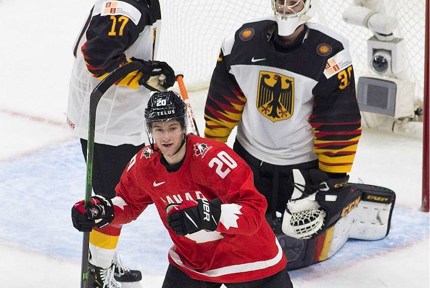 Canada's Dawson Mercer (20) celebrates a goal scored on Germany's goalie  Jonas Gahr (30) during second period IIHF World Junior Hockey Championship action on Saturday, Dec. 26, 2020 in Edmonton. 