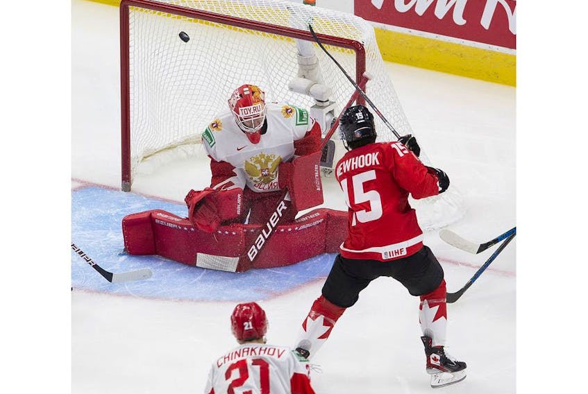  Canada’s Alex Newhook (15) scores on Russia’s Yaroslav Askarov (1) during first period IIHF World Junior Hockey Championship semifinal action on Monday, Jan. 4, 2021 in Edmonton.