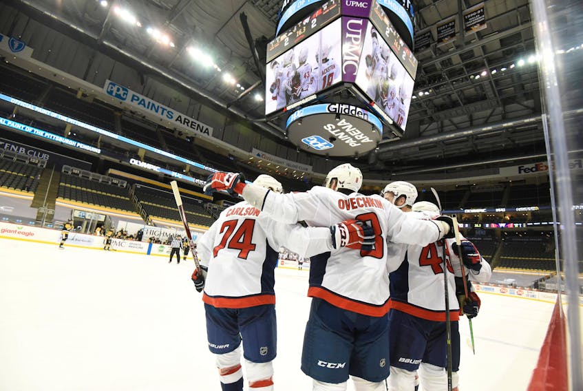 Washington Capitals' Alex Ovechkin (8) celebrates with teammates after a first period goal against the Pittsburgh Penguins at PPG Paints Arena. 