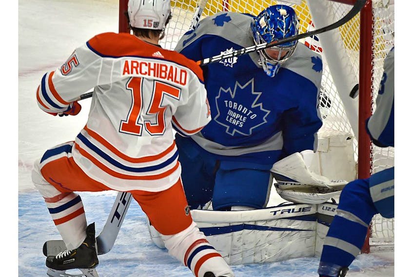 Edmonton Oilers Josh Archibald (15) scores on Toronto Maple Leafs goalie Frederik Andersen (31) during NHL action at Rogers Place in Edmonton, January 30, 2021. 