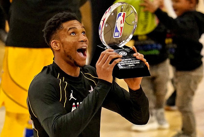 Team LeBron forward Giannis Antetokounmpo of the Milwaukee Bucks (34)  reacts to being named the MVP of the 2021 NBA All-Star Game at State Farm Arena.