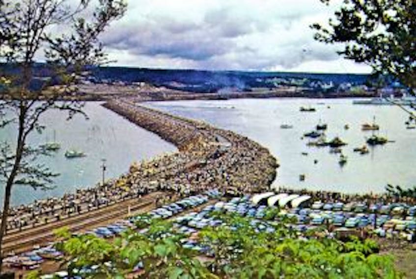 ['Today marks 60 years since the Canso Causeway opened. This photo was taken in 1955, as hundreds walked across the causeway for the first time. Before it was built, the only access between Cape Breton Island and Mainland Nova Scotia was by ferry.']