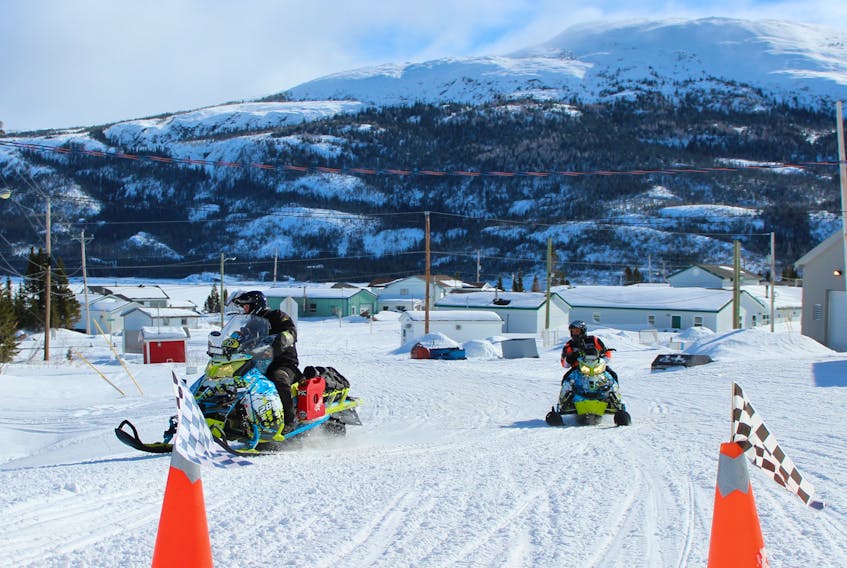 Team Iron City Racing, Justin Heulin (Grand le Pierre) and Ryan Pratt (Labrador City) arrive at the check point in Postville during the 2018 Cain's Quest snowmobile race March 4.