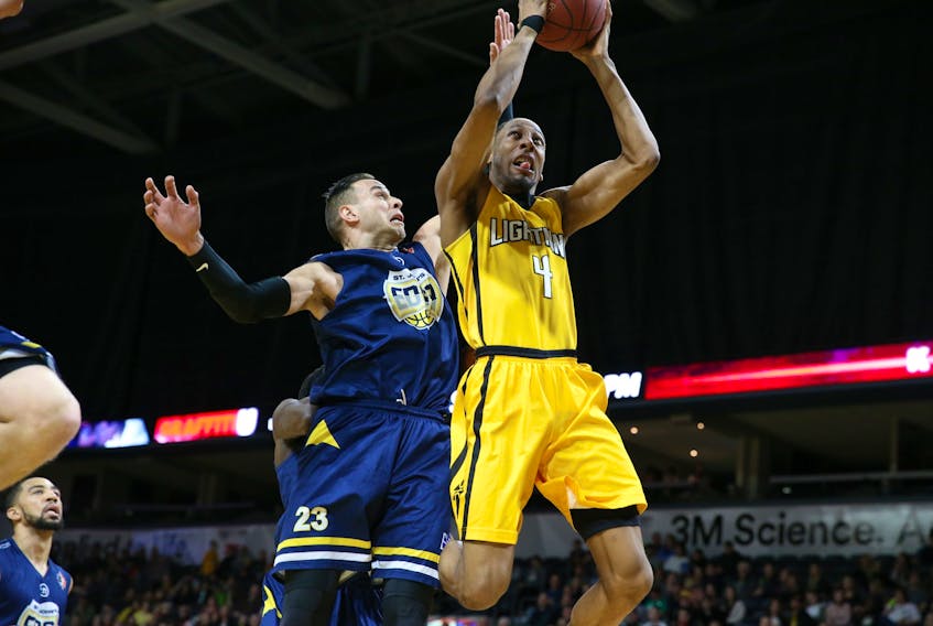 Carl English (23) of the St. John's Edge comes in from behind as he attempts to prevent Marcus Capers of the London Lightning from scoring during Game 2 of their National Basketball League of Canada division final Thursday night in London, Ont. St. John's won 112-104 to tie the best-of-seven series at 1-1. — London Lightning photo via the St. John's Edge.