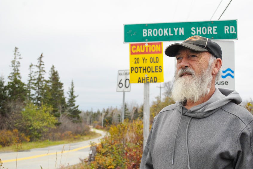 Stephen Bowers, from Eagle Head, recently made signs to warn drives about potholes on the road. He had to remove the signs Nov. 9, but he hopes to get permission to put them back up.