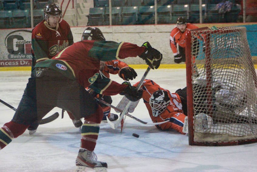 Northeast Sabres’ goalie Rob Roberts reaches back to make an unbelievable save in the third period of Saturday night’s game against the Grand Falls-Windsor Blades.