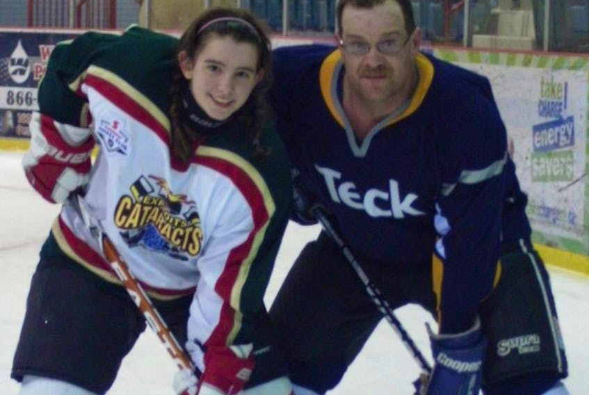 The second annual Amber Chippett Memorial Scholarship fundraiser a skate-a-thon and hockey game will be taking place March 18 T. A. Soper Memorial Stadium in Buchans.  Amber, who died in an automobile accident on the Buchans Highway Sept. 4, 2015 loved playing hockey and spent a lot of her time at that stadium.  She is pictured with her dad Mark Chippett at another of her favourite spots, the Joe Bryne Memorial Stadium in Grand Falls-Windsor.