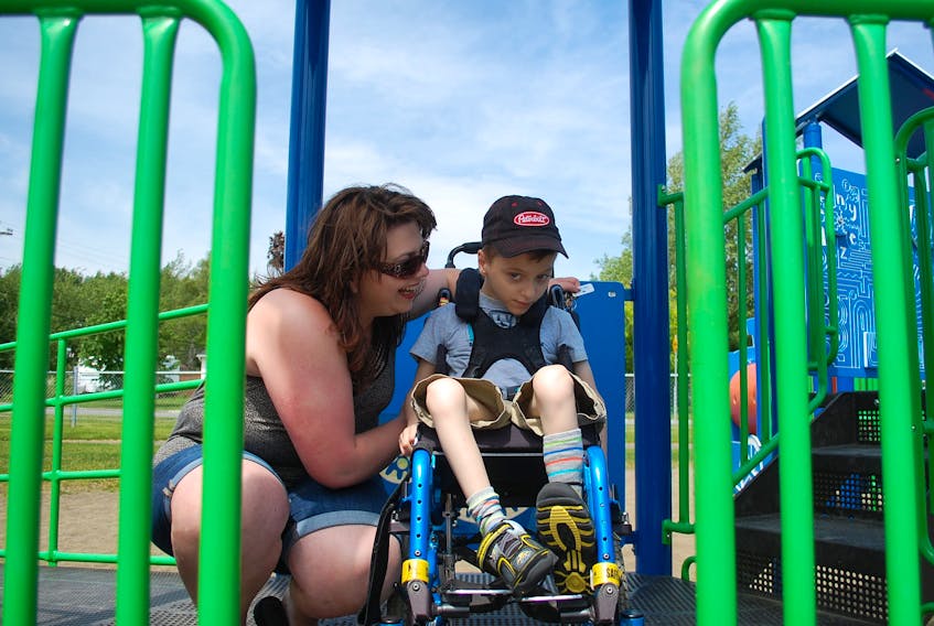Erica Billings and her son, Joel Stride, make the most of a warm summer day at the Sutherland Drive Park July 9.