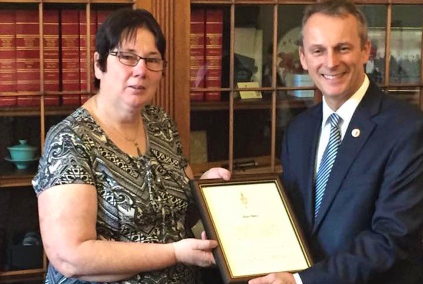 Laurie Ballard received the Senate 150th Anniversary Medal for her dedication to volunteering and making her community a better place. She received her certificate from Senator David Wells at a special event in Ottawa.