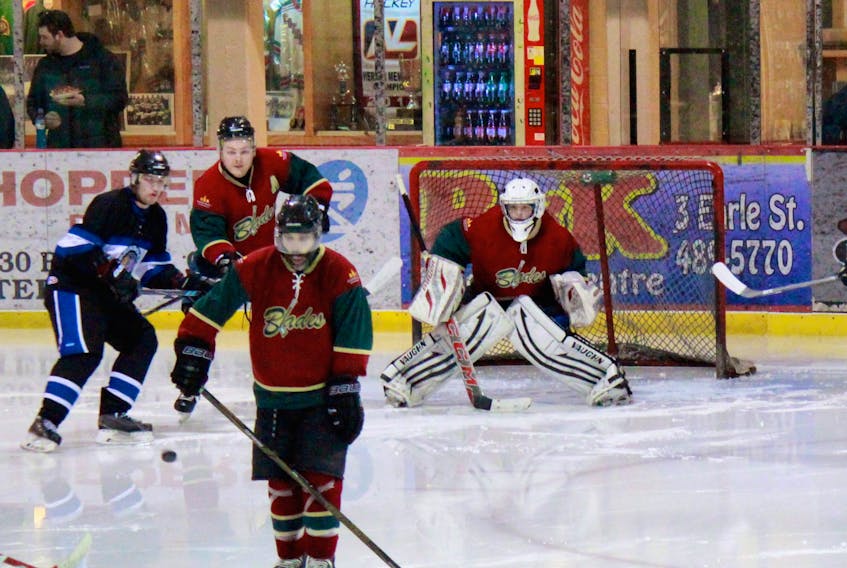 Exploits Blades goalie Carter Fancey eyes down a point shot from Springdale Braves’ defenceman Jeremy Drover during second-period action in Sunday’s game.