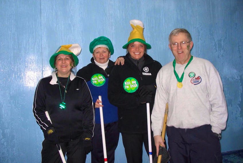 Participants in the annual Buchans SOP Bonspiel over the St. Patrick’s Day weekend tend to dress for the occasion. Anna Glavine, Christine Bursey, Melanie (Brace) Dixon and David Glavine showed their spirit with buttons, hats and face tattoos at the 2009 event.