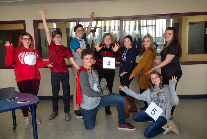 Cast members of “The 25th Annual Putnam County Spelling Bee” strike a pose before rehearsing for their upcoming shows.