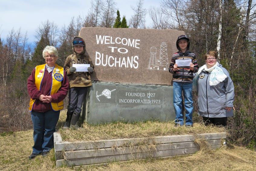 Maddy Penney, his brother M. J. Penney and their mom Melanie Brown, were out on Monday afternoon, May 14 to continue Maddy's mission – to pick up litter from the roadsides from Buchans to Millertown. To recognize their initiative Buchans Lions Club president Hilda Budden and treasurer Lion Judy White presented Maddy (left) and his brother M. J.  with monetary donations which the boys plan to put towards their education funds.