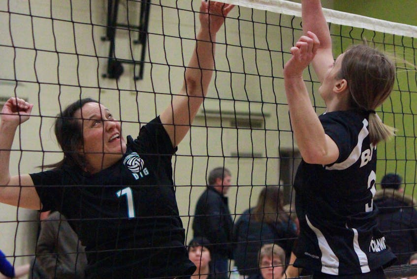 Wendy Fisher of LiveFit battles at the net with a member of Twilly during a Tier 1 women’s match on Saturday.