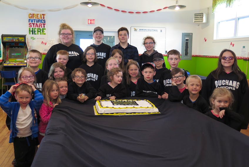Members of Buchans Minor Hockey held their closing banquet at the James Hornell Boys and Girls Club Tuesday, June 19. To commemorate the occasion they had a cake featuring a photo of the team which they gathered around for a team photo with their youth coaches and volunteers.