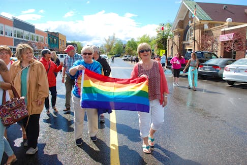 Vera Blackmore, grandmother of a transgender child, and Trudy Evans show their pride as they march on June 22.