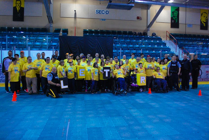 (Pictured) Andre Gill of the Grand Falls-Windsor Cataracts, Special Olympic athletes, and members of law enforcement.