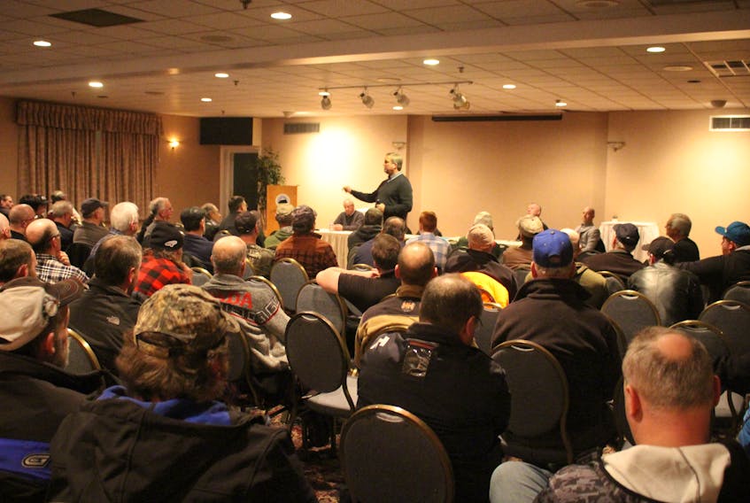About 100 people turned out for a meeting about salmon fishing in Grand Falls-Windsor. Fisheries and Land Resources Minister Gerry Byrne was one of several panelists arguing for retention fishing.