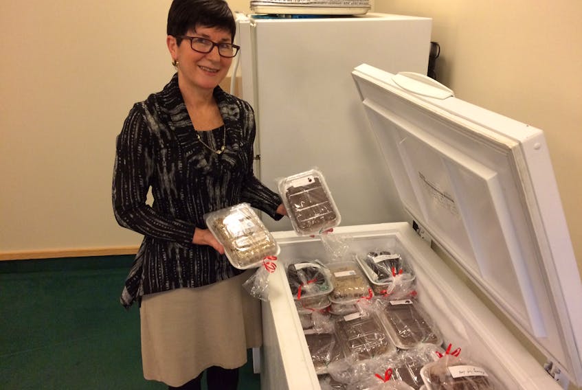 Arlene Elliott shows off the freezer full of cookies that will be on offer at this Saturday’s moose burger and bake sale at the Pentecostal Church in Grand Falls-Windsor.