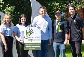 The Carbonear Green Team mapped out three trails in the town as part of a project between the town and Conservation Corps of Newfoundland and Labrador. Local team members are, from left, Allison Seward, Abigail Clark, Colby Sharpe, and Dylan Lambert. They are joined by CCNL regional supervisor Ben Piercey, right, who was present to watch the team present their project to council members.