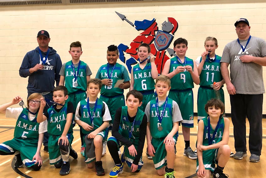 Amherst A’s U12 boys celebrating with their silver medals are: (front, from left) Ethan Amos, Gavin Hoeg, Jonah MacGlashen, Tyler Quilty, Nicholas Moore, Alex Rossong, (back, from left) assistant coach Mark Calder, Ayden Ellis, Aiden Lawrence, Beau Janes, Jake Bastarache, Noah Petten, and coach Scott Reid.