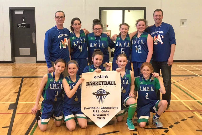 The AMBA U12 girls celebrate with their newly minted medals after capturing the Division 4 provincial championship in Truro. The new provincial champs are: (front, from left) Lauren Mosher, Addison Dill, Sadie Harrison, Chase Codling, Reese Leblanc, (back, from left) assistant coach Jamie Spicer, Jorja Spicer, Jordyn Wolfe, Reagan Bushen, Isabelle Shears, and coach John Bushen.