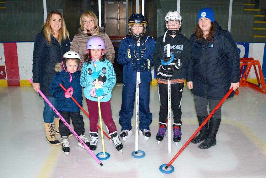 A free ringette learning session will be held next Saturday afternoon at Amherst Stadium as part of the Come Try Ringette program. Also, the After the Bell Skating program allows youth to skate and to play a bit of ringette shinny at Amherst Stadium. People taking a break from the fun Wednesday afternoon includes: (from left) Chelsea Baird, Wanda St. Peter and her two granddaughters, four-year-old Evey and seven-year-old Nya Chamberlain, 13-year-old River Sears-Tower, 12-year-old Connor Masters, and Tamara Porter. Porter and Baird, both Town of Amherst employees, have helped bring ringette to Amherst Stadium.
