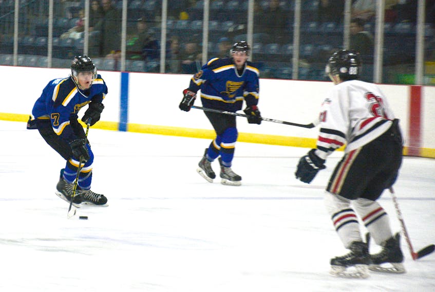 Nate Stone moves the puck up ice for the Cumberland County Blues. Stone, a Springhiller, scored for the Blues Friday night in Springhill.
