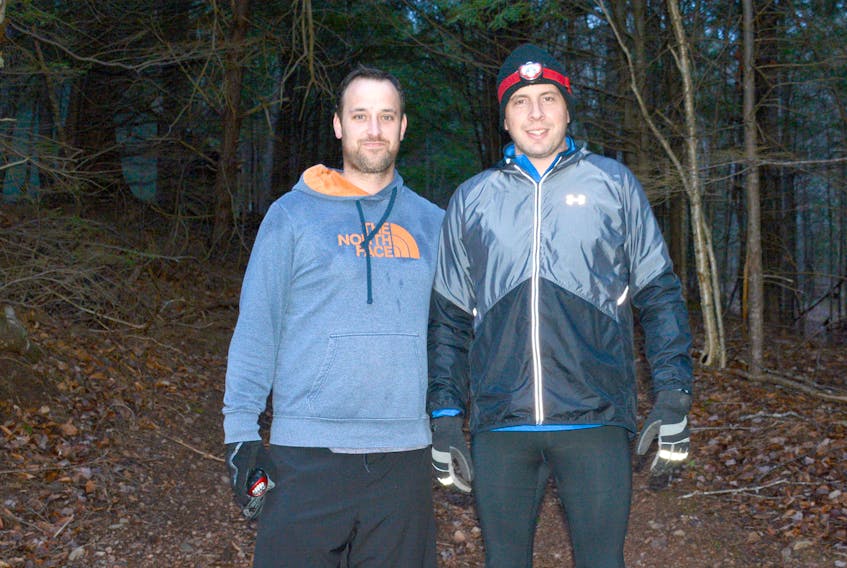 Mike Hudson (left) and John Collicott ran the High Head Trail in Wentworth from dusk until dawn last Saturday starting at 5 p.m. In the end they went up and down the trail nine times, raising money in memory of Mitchell Richard, who passed away Nov. 25. This photo was taken about one hour before they started the run. Hudson is from Collingwood and Collicutt from Amherst. Both took up running about 10 years ago.