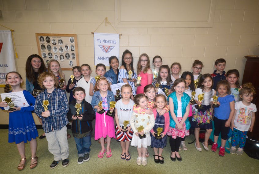 After eating pizza and receiving awards at their 2018 banquet, and before going swimming, members of the Amherst Skating Club gathered for photo at the YMCA of Cumberland in Amherst on Tuesday night.