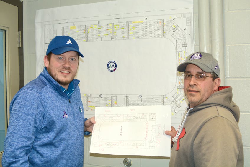 Corey Crocker, chair of the operations committee for the Fred Page Cup, and Ron Lake, acting president of the Amherst Ramblers, stand in front of the Fred Page Cup seating map. There are currently about 200 Fred Page Cup packages sold to the public so far, and about 200 set are aside for the teams coming to compete in Amherst for the Fred Page Cup.