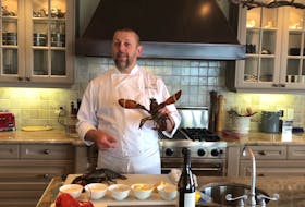 Fox Harb'r Resort's executive chef Shane Robillard shows off his pride of local lobster.