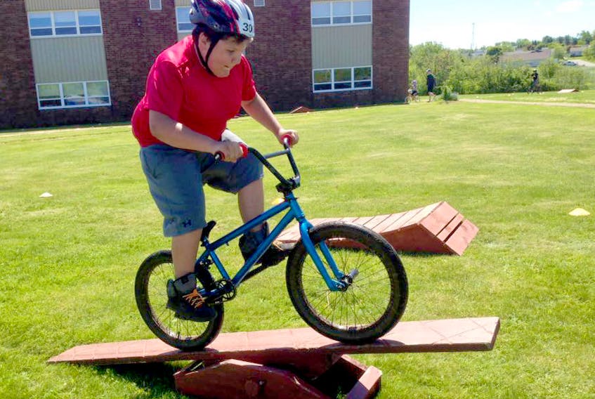 Riley MacDonald participates in the 2017 community bike rodeo at E.B. Chandler. The rodeo is returning on Friday as Amherst kicks off its Celebrate Summer campaign.