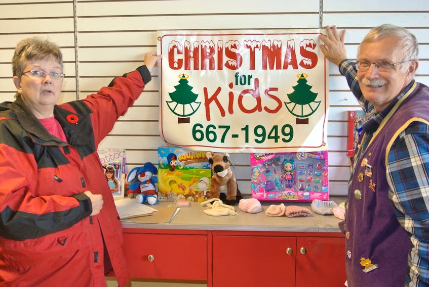 Barbara and Phil Baxter hold up the Christmas for Kids sign as the organization prepares for its 25th annual campaign that makes sure every child in Cumberland has a gift under the tree on Christmas morning. The program will begin taking requests on Nov. 12 and continue until Dec. 7. The Christmas for Kids number, which also accepts food box requests, is unchanged at 902-667-1949.