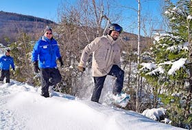 Staff at Ski Wentworth try out some of the rental snowshoes available at the hill. Following the Get Up There snow shoe trail from the bottom of the Robin's Run, it takes about an hour to hike to the top of the mountain.