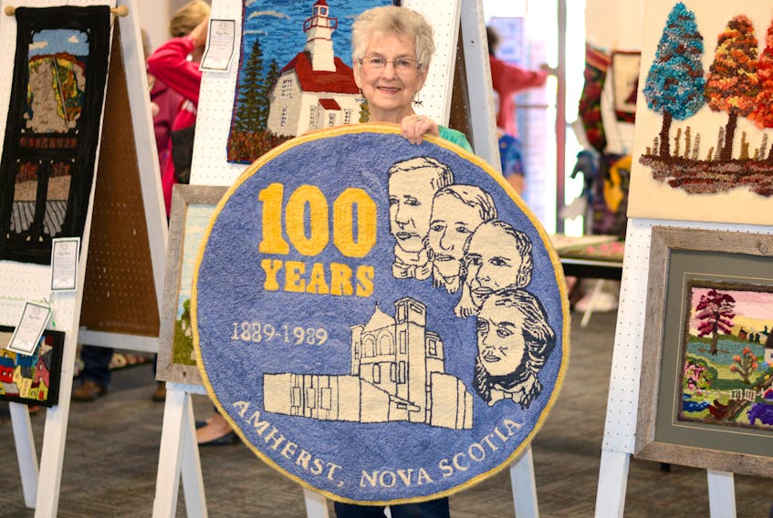 Edie Arsenault helped hook this rug for Amherst’s centennial celebration in 1989. The rug was on display at the Community Credit Union Business Innovation Centre, the old Amherst town hall, last week during the 10th anniversary of the Nova Scotia Fibre Arts Festival in Amherst.