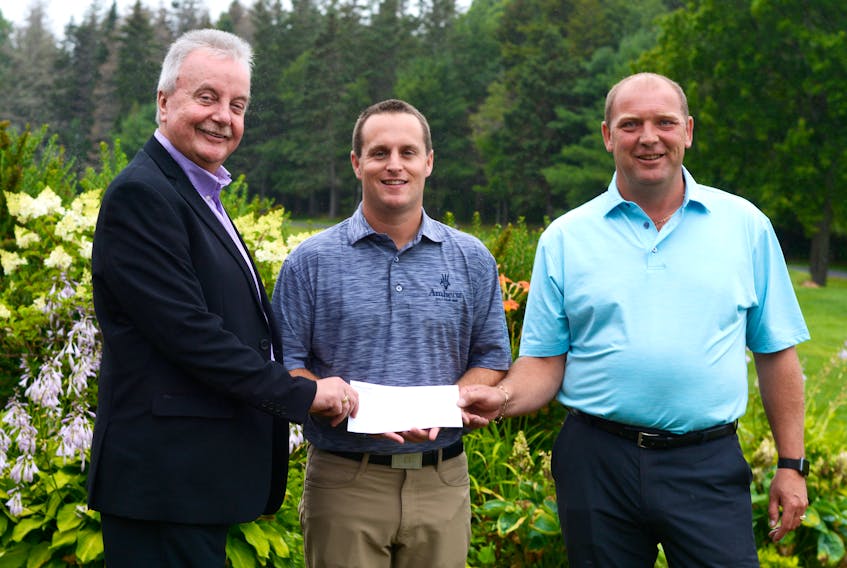 Michael Archibald (centre), club pro at the Amherst Golf Club, accepts a sponsorship cheque from the Amherst Open’s two top sponsors, Bill Munro (left) of Archway Insurance, and Ken Parrell, of Tantramar Chevrolet/GMC. Parrell is also the president of the Amherst Golf Club. Archibald thanked all the sponsors, close to 50, who help make the Amherst Open a success. “They make all the difference in the world,” said Archibald.