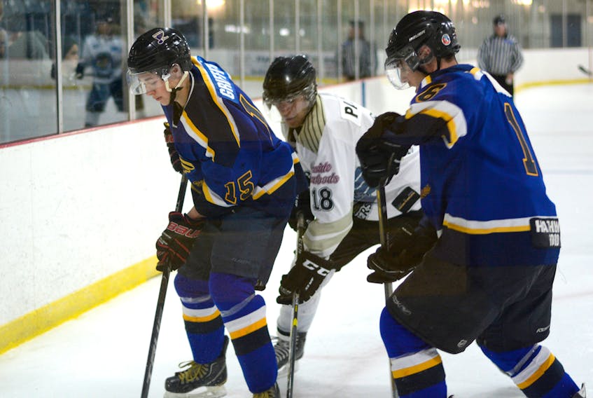Blues rookie Alex Griffiths (left), seen here digging for the puck last Friday against the Privateers, is second on the Blues point board with five goals. “He’s a natural with the puck, he has a quick release and he drives hard to the net,” said Blues coach Phil Lynds. Griffiths is from Springhill. The Blues host the Brookfield Elks Friday at 7:30 p.m.
