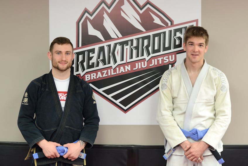 Justus Copeland (left) and Jeremy Misken, are co-owner/operators of Breakthrough Brazilian Jiu Jitsu in downtown Amherst. They have been training and competing in the sport for six years and encourage others to give the sport a try. They offer a free week trial. “You have nothing to lose if you give it a shot,” said Copeland.