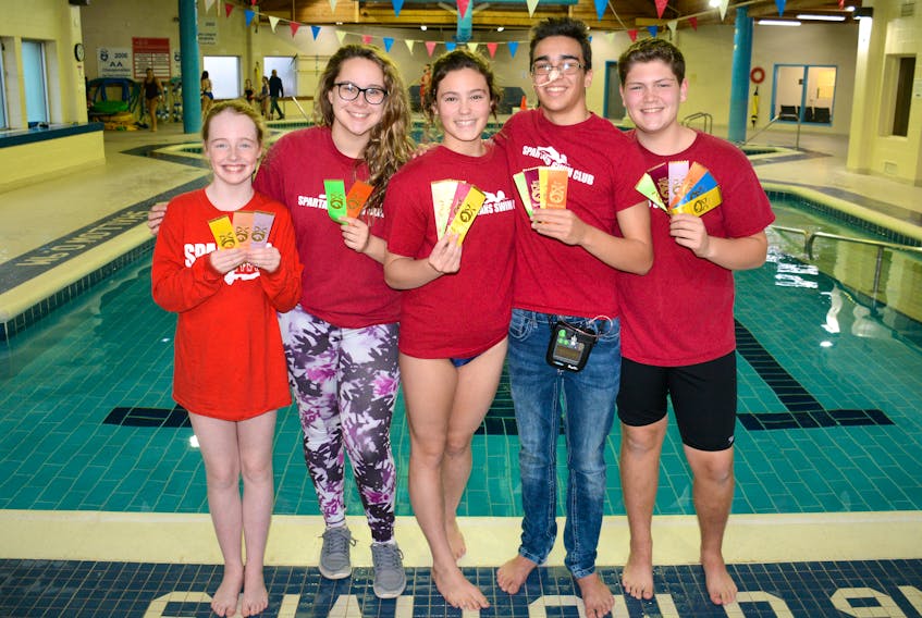 Spartans swimmers proudly display the ribbons they recently won at Acadia University. Seen here at their home pool at the Cumberland YMCA are: (from left) Abbie Byrnes, Abbie Smith, Lauren Millard, Adam Bobadilla-Amaran, and Jordan Beaton.
