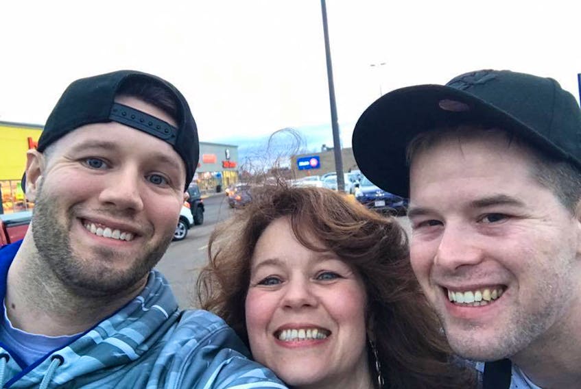 Dylan Gogan (right) is in a medically-induced coma at the Cumberland Regional Health Care Centre after being severely beaten during a jailhouse incident in Alberta in March. His mother, Christine Arsenault, (right) had been trying unsuccessfully to get him transferred to a hospital in Nova Scotia and got the good news late Tuesday that he was being transferred home. Also in the photo is Dylan’s brother, Aaron.